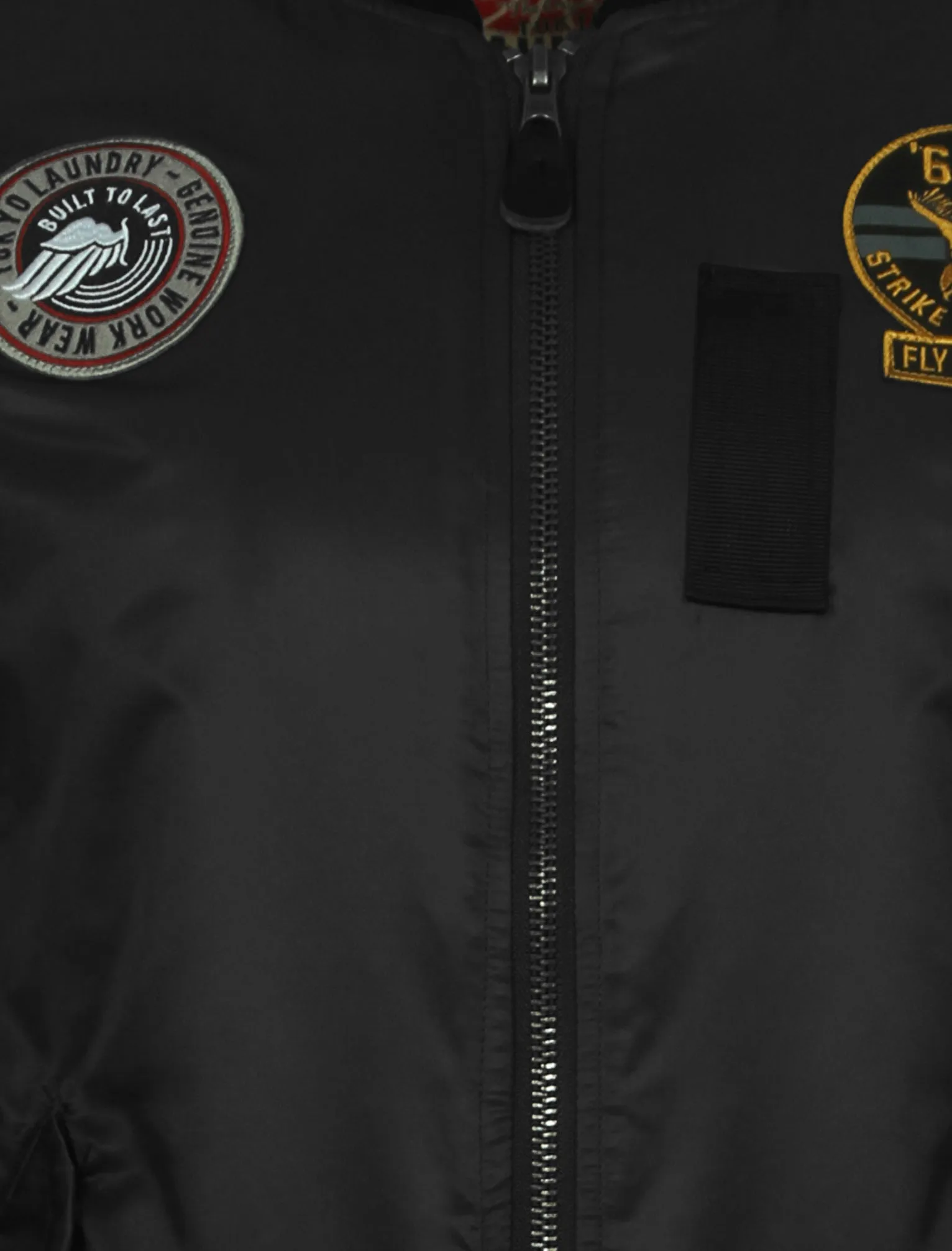 Basnett Bomber Jacket with Patches In Black - Tokyo Laundry